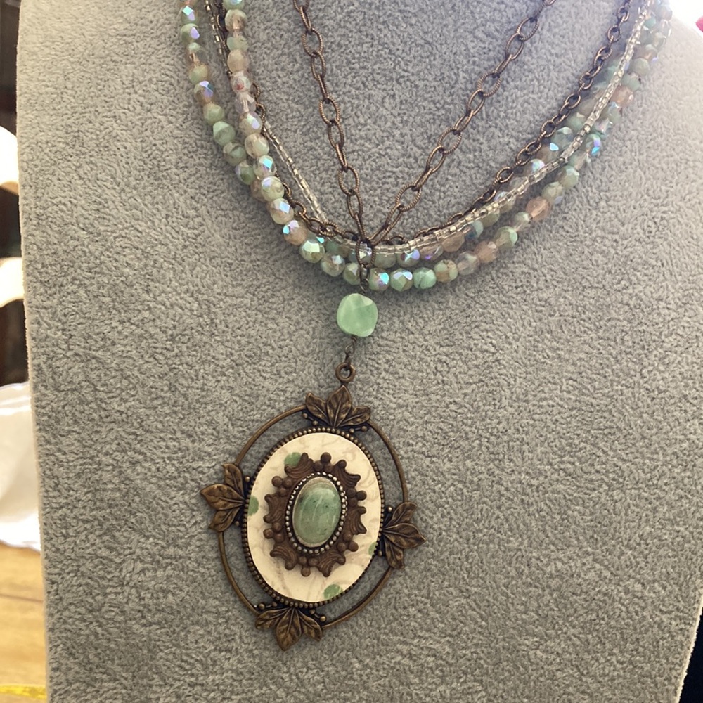 Vintage pendant and crystal and chain strand.